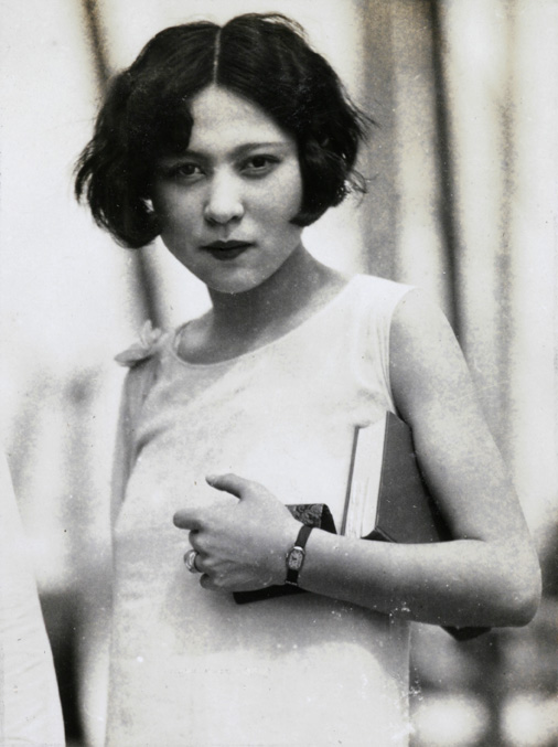 A portrait of a woman holding a book and purse. By P.S. Foo, circa 1935.