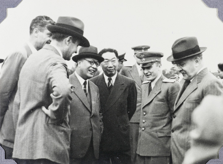 Moscow Airport, 1945. W. Averell Harriman, Fu Bingchang, Victor Hu, and a Soviet interpreter conversing with Vyacheslav Molotov (Soviet Foreign Minister).